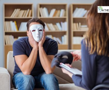 Man wearing a mask in therapy, symbolizing hidden truths and recognizing toxic relationship red flags.