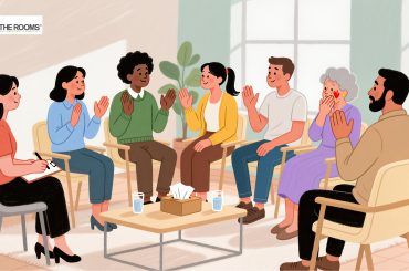 Illustration of a diverse group of people sitting in a circle, smiling, clapping, and supporting one another during a recovery meeting.
