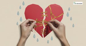 Hands mending a torn paper heart with golden threads, symbolizing emotional healing and rebuilding life after hardship.